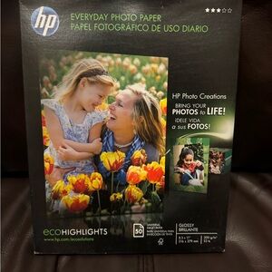 HP Glossy Photo Paper Pack in Black Packaging with Yellow & Red Accents
